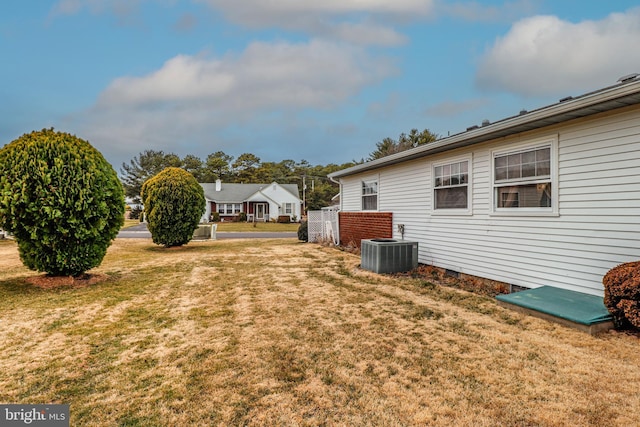 view of yard featuring central air condition unit