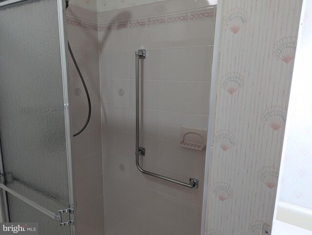 bathroom featuring a stall shower