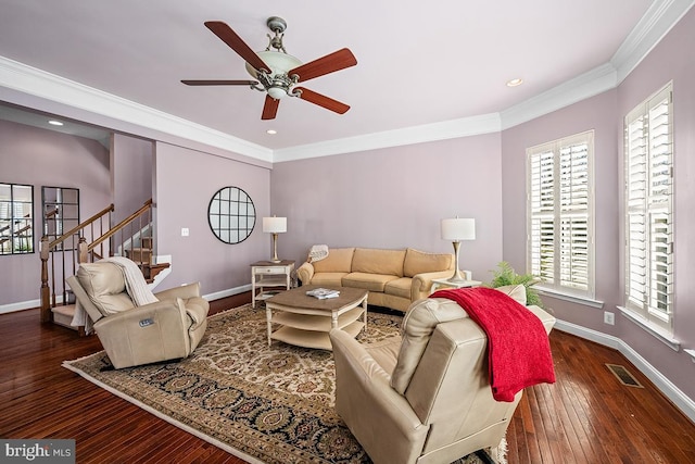 living room featuring baseboards, stairs, and crown molding