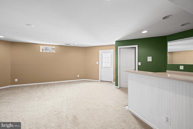 empty room with carpet flooring, recessed lighting, and baseboards