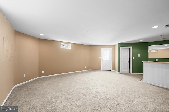 empty room with recessed lighting, visible vents, baseboards, and light colored carpet