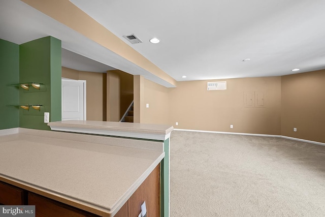 interior space featuring visible vents, recessed lighting, stairway, carpet floors, and baseboards