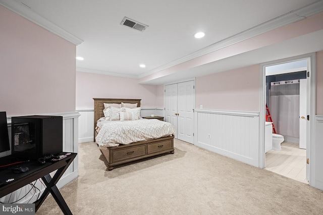 bedroom featuring visible vents, recessed lighting, wainscoting, crown molding, and light colored carpet