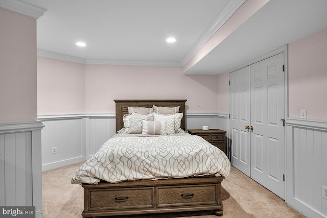 bedroom with recessed lighting, a wainscoted wall, light colored carpet, and ornamental molding