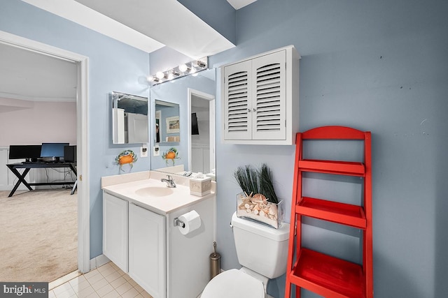 bathroom featuring toilet and vanity