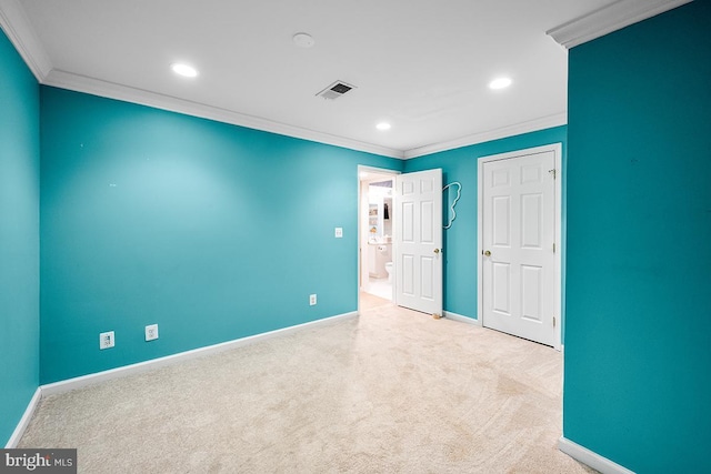 unfurnished bedroom with visible vents, crown molding, baseboards, carpet flooring, and recessed lighting