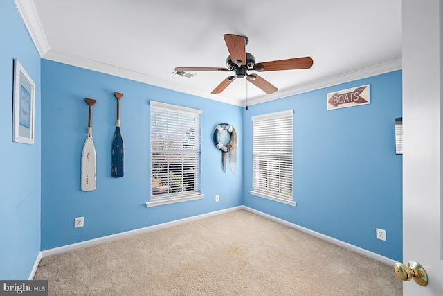 unfurnished room with carpet flooring, baseboards, visible vents, and ornamental molding