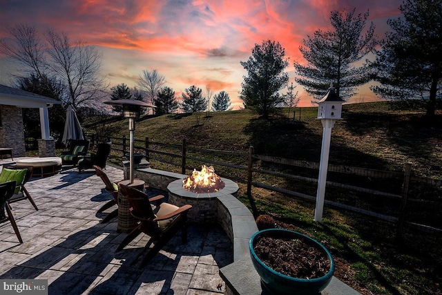 view of patio with fence and an outdoor fire pit