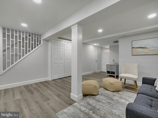 interior space with recessed lighting, wood finished floors, visible vents, and baseboards