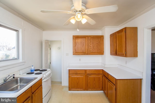 kitchen featuring a sink, light countertops, brown cabinetry, and white electric stove