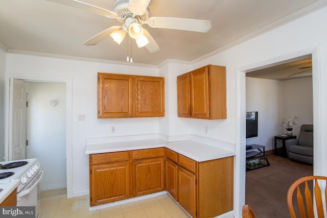 kitchen with a ceiling fan, light countertops, crown molding, brown cabinets, and white range with electric stovetop