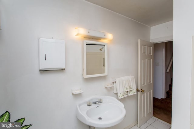 bathroom featuring tile patterned floors and a sink