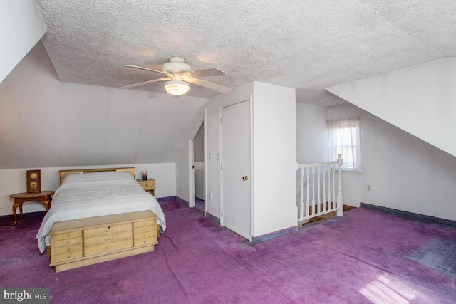 carpeted bedroom with a textured ceiling, lofted ceiling, and baseboards