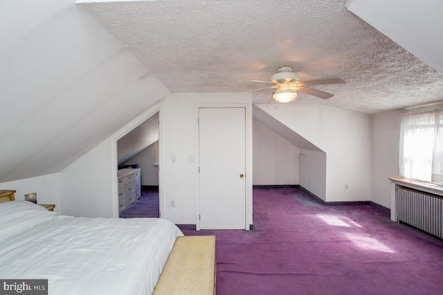 carpeted bedroom featuring baseboards, a textured ceiling, radiator heating unit, and lofted ceiling