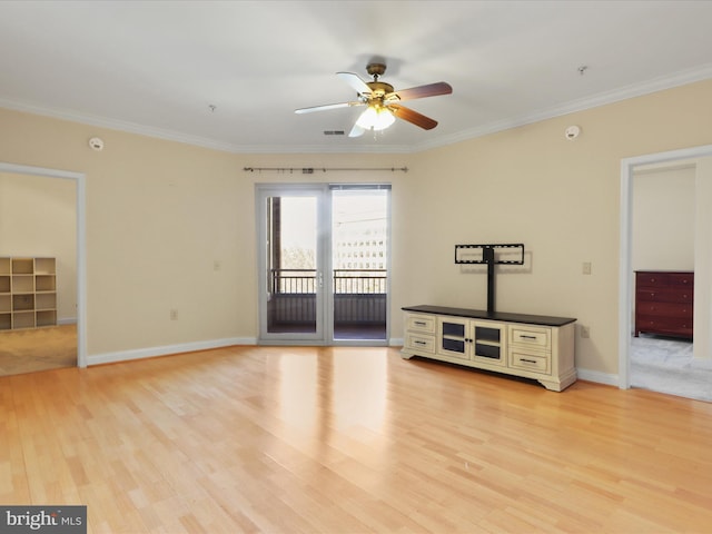 interior space with baseboards, ceiling fan, ornamental molding, and light wood finished floors