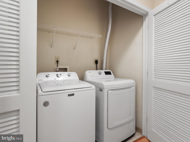 laundry room with independent washer and dryer and laundry area