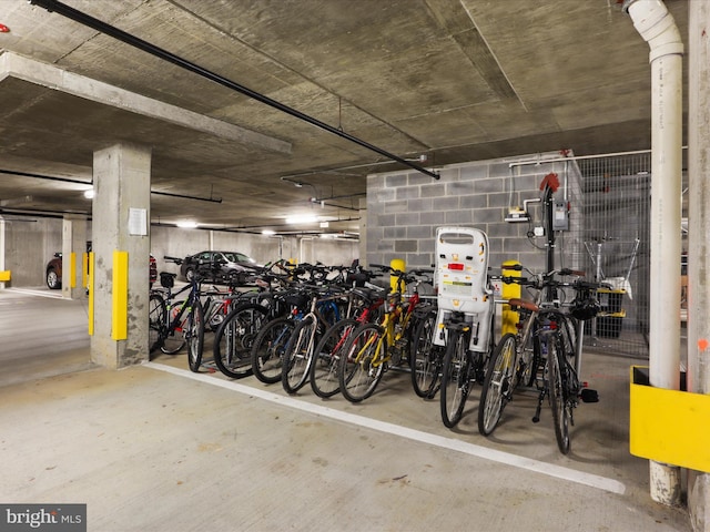 garage featuring concrete block wall and bike storage