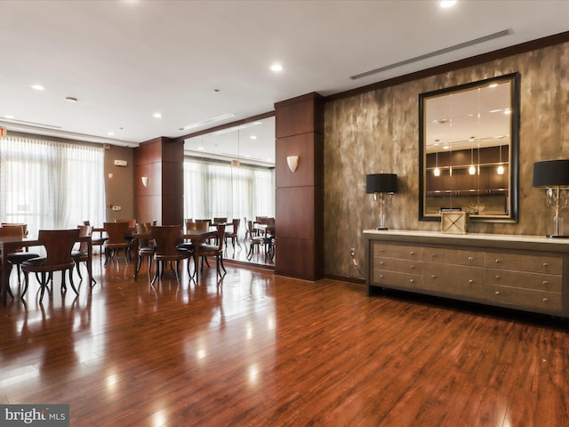 dining room with dark wood finished floors, visible vents, and recessed lighting