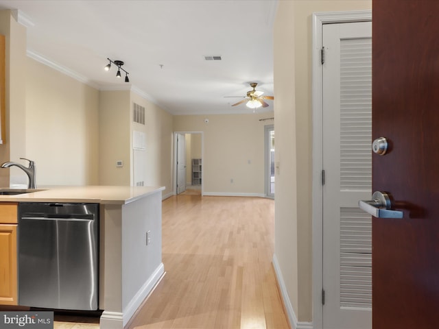 kitchen featuring visible vents, ceiling fan, a sink, dishwasher, and light wood-type flooring