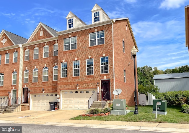 view of property featuring brick siding, an attached garage, and concrete driveway