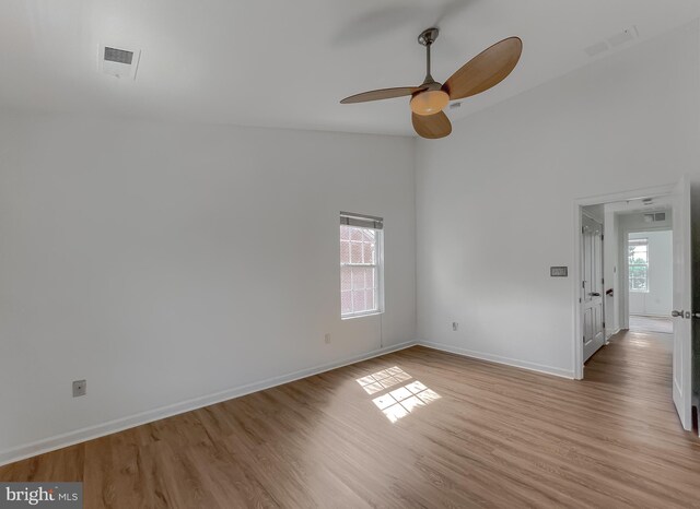 spare room with visible vents, plenty of natural light, and light wood-type flooring