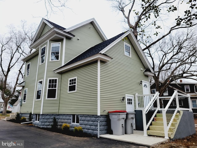 view of side of property featuring a deck