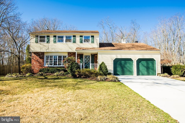 view of front of house featuring brick siding, driveway, an attached garage, and a front lawn