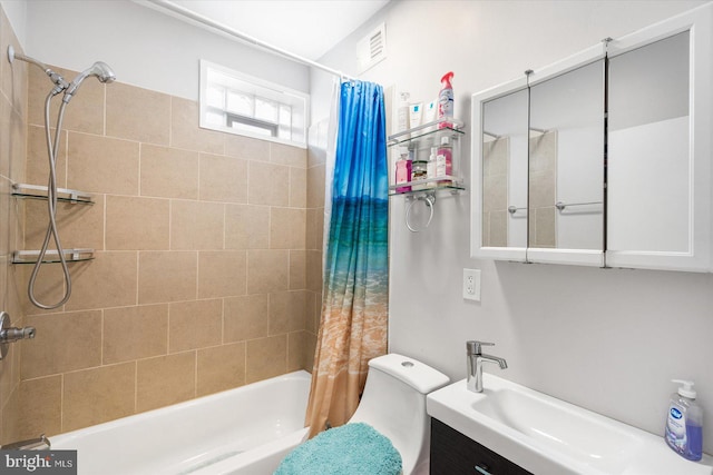 bathroom with shower / bath combo with shower curtain, vanity, toilet, and visible vents