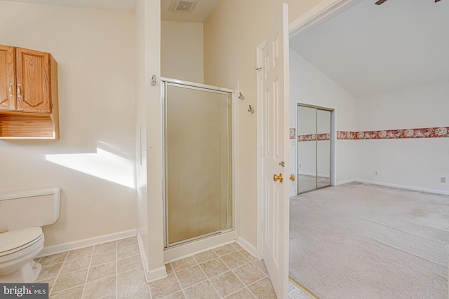 full bath featuring visible vents, a shower stall, vaulted ceiling, tile patterned floors, and toilet