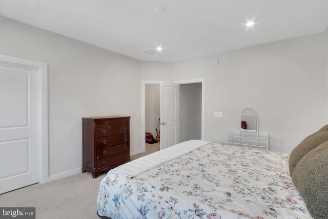 bedroom featuring recessed lighting, baseboards, and light carpet
