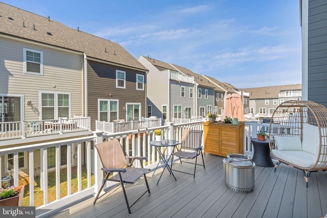 wooden deck featuring a residential view