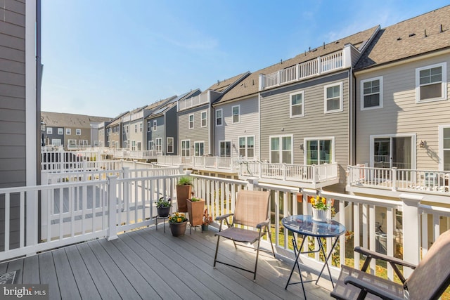 wooden deck with a residential view