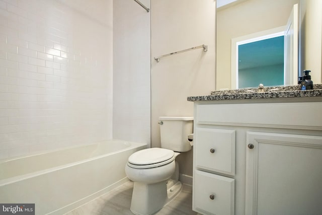 bathroom with vanity, toilet, and tub / shower combination