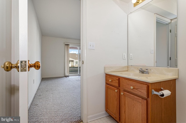 bathroom with baseboards and vanity