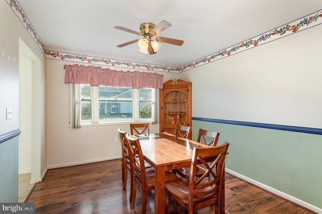 dining area with wood finished floors, baseboards, and ceiling fan