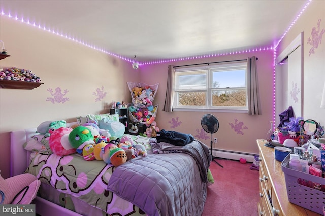 bedroom with a baseboard radiator and carpet flooring