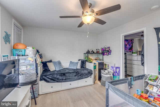 bedroom with a ceiling fan and wood finished floors