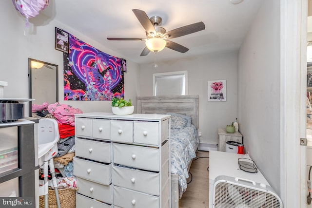 bedroom with wood finished floors and ceiling fan