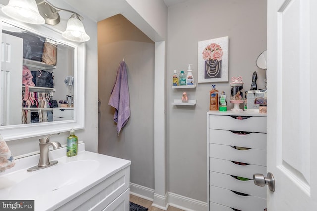 bathroom featuring vanity and baseboards