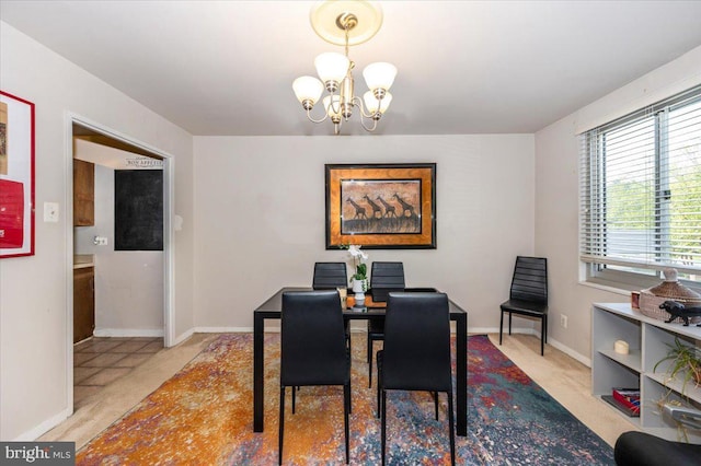 1900 Lyttonsville Rd Unit 418, Silver Spring, MD 20910 - dining area with baseboards and a notable chandelier