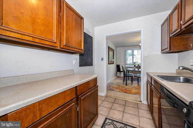 1900 Lyttonsville Rd Unit 418, Silver Spring, MD 20910 - kitchen with light countertops, baseboards, a sink, and dishwasher