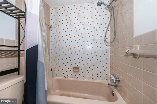 1900 Lyttonsville Rd Unit 418, Silver Spring, MD 20910 - bathroom featuring toilet, tile walls, and shower / bath combo