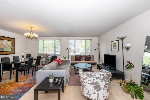 1900 Lyttonsville Rd Unit 418, Silver Spring, MD 20910 - living room featuring a chandelier, plenty of natural light, and light carpet