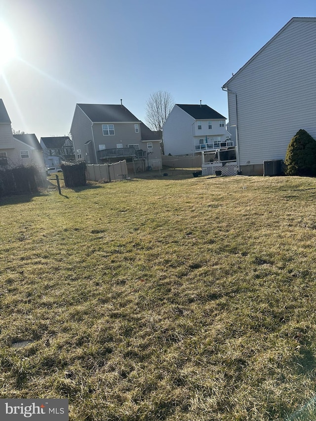 view of yard featuring a residential view and fence