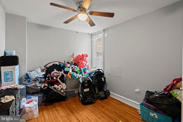 bedroom with ceiling fan and wood finished floors