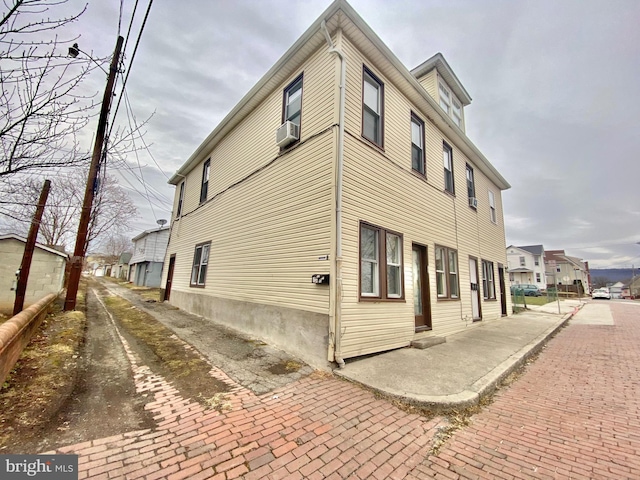 view of side of home featuring a residential view