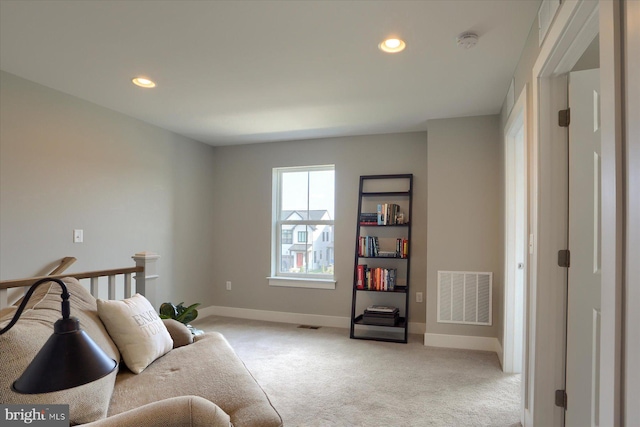 sitting room featuring visible vents, recessed lighting, baseboards, and carpet