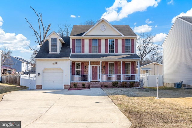 view of front of home with covered porch, concrete driveway, a garage, and fence