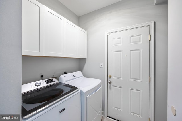 laundry room with cabinet space and independent washer and dryer