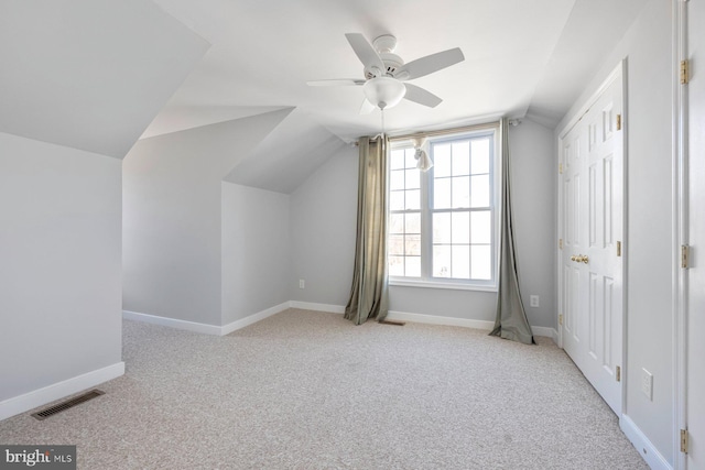 bonus room with visible vents, lofted ceiling, carpet, baseboards, and ceiling fan